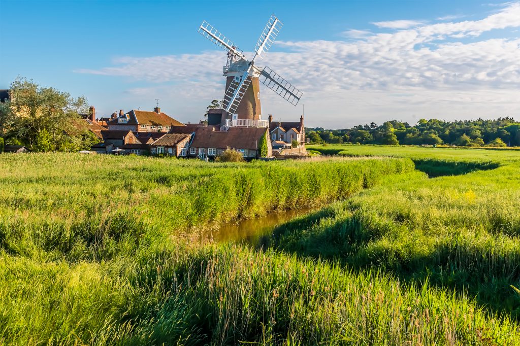 The village of Cley and drainage channels in the marshes in Norfolk, UK